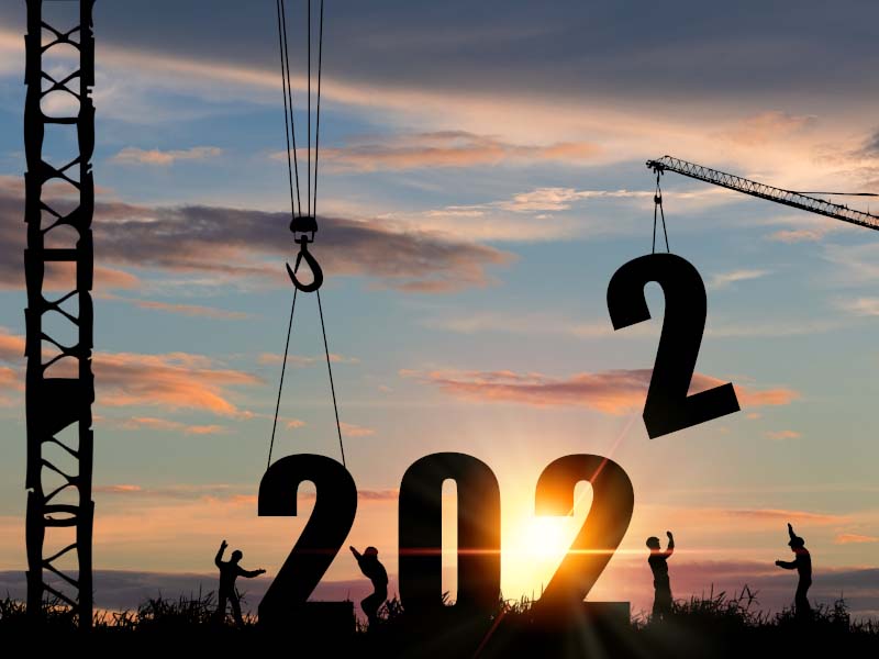 Silhouette of construction worker with crane and cloudy sky for preparation of welcome 2022 new year party and change new business.