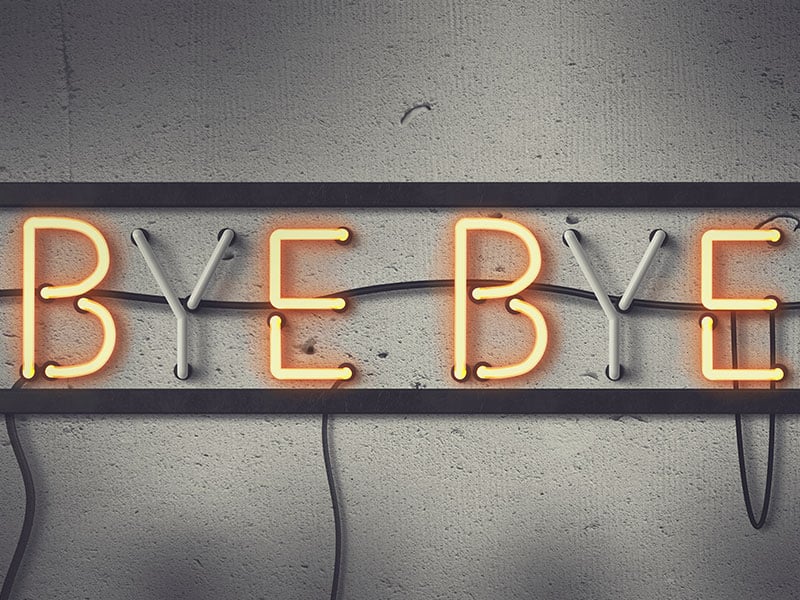 Neon sign showing the words "BYE BYE", with the B and E lit yellow and the Y seemingly turned off, against a concrete background
